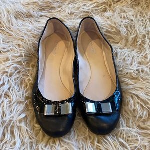 Black Coach flats with silver bow